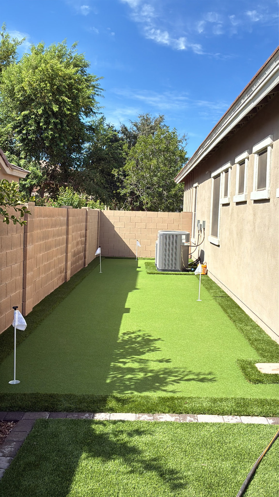 Side yard putting green and turf lawn installed by Life Turf in Arizona